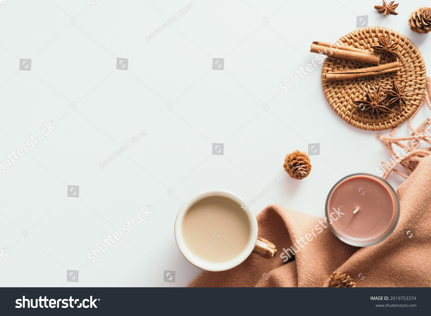 Cozy home desk table with plaid, coffee cup, candle on white background. Top view, flat lay, copy space. Autumn composition. Nordic hygge style concept. #2019753374