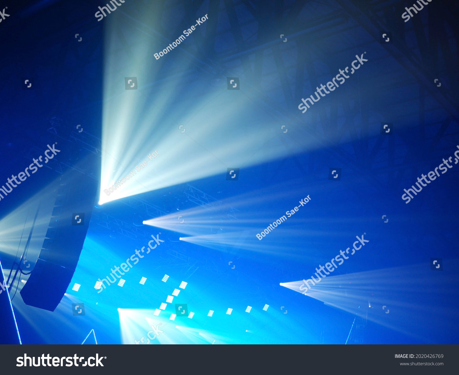 K-Pop music theme or Live concert background silhouette line array or loudspeaker system with stage lighting at a concert in music hall. Enjoy Music and Entertainment content. (selective focus) #2020426769
