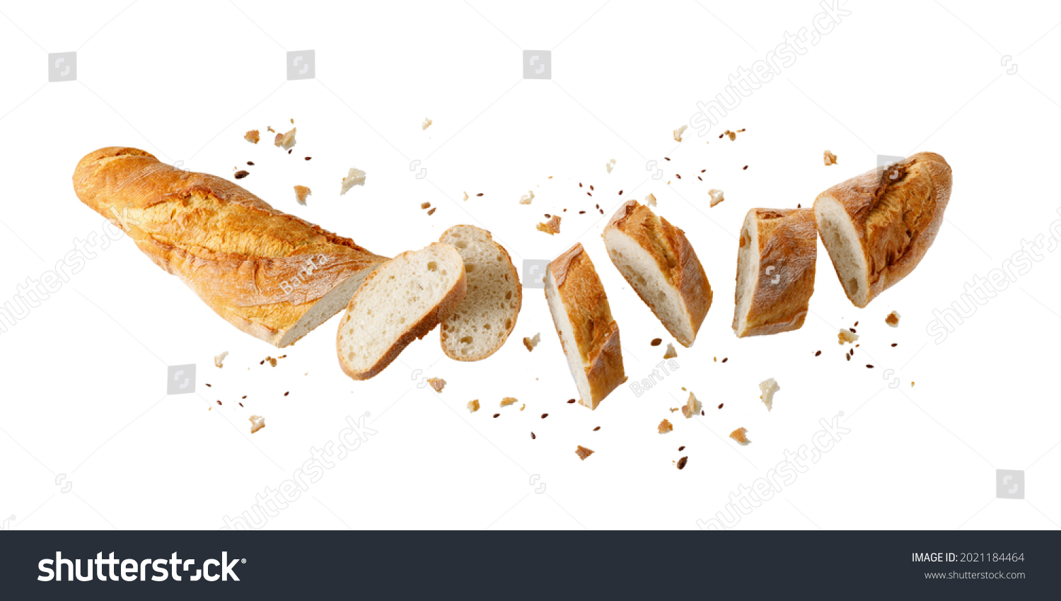 Cutting fresh baked loaf wheat baguette bread  with crumbs and seeds flying isolated on white background.  #2021184464