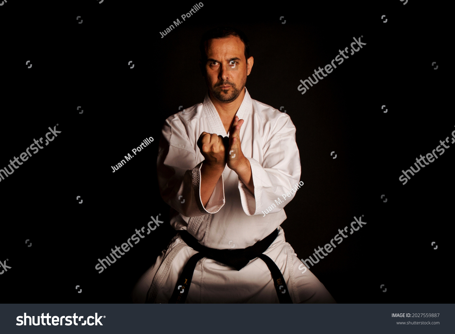 karate man kicked in hand #2027559887
