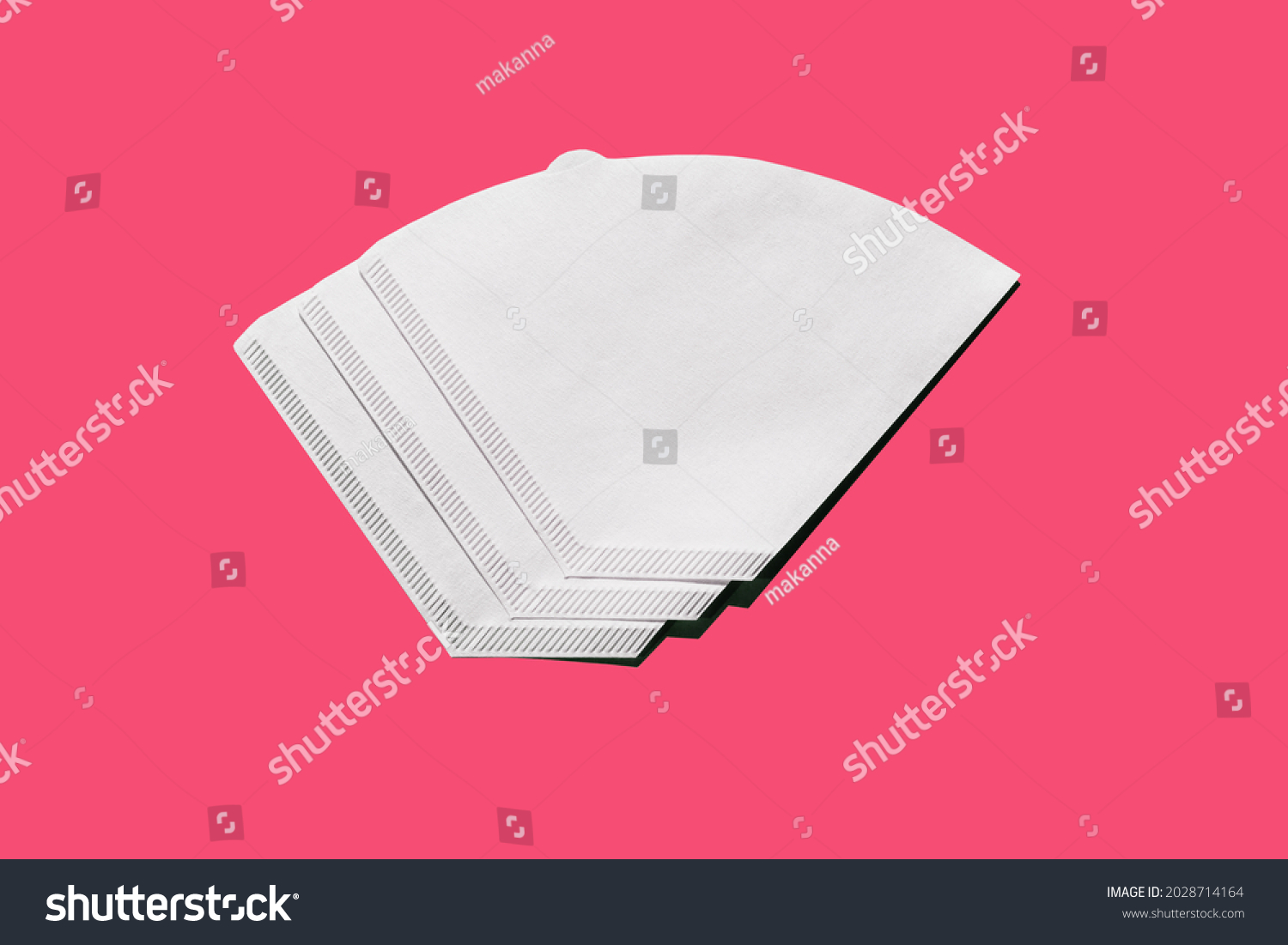 Bleached paper coffee filter isolated on pink background. Alternative brewing pour over v60 concept. Minimalistic abstract background for store, shop, retail. mock up, top view, place for text #2028714164