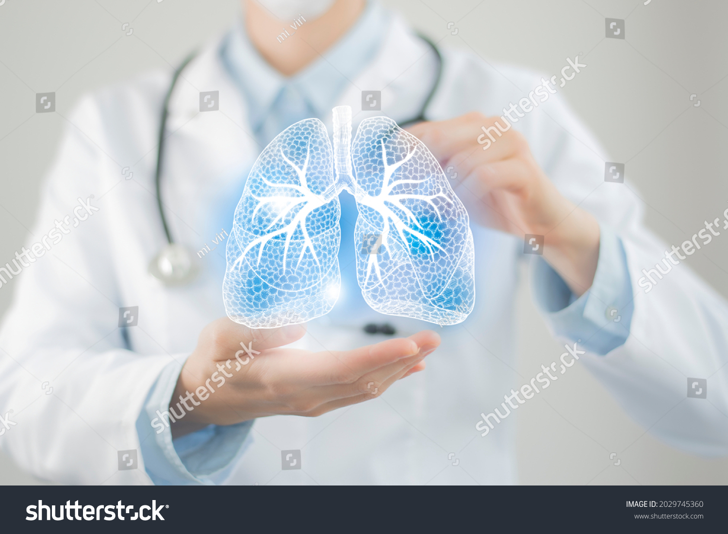 Female doctor holding virtual Lungs in hand. Handrawn human organ, copy space on right side, raw photo colors. Healthcare hospital service concept stock photo #2029745360