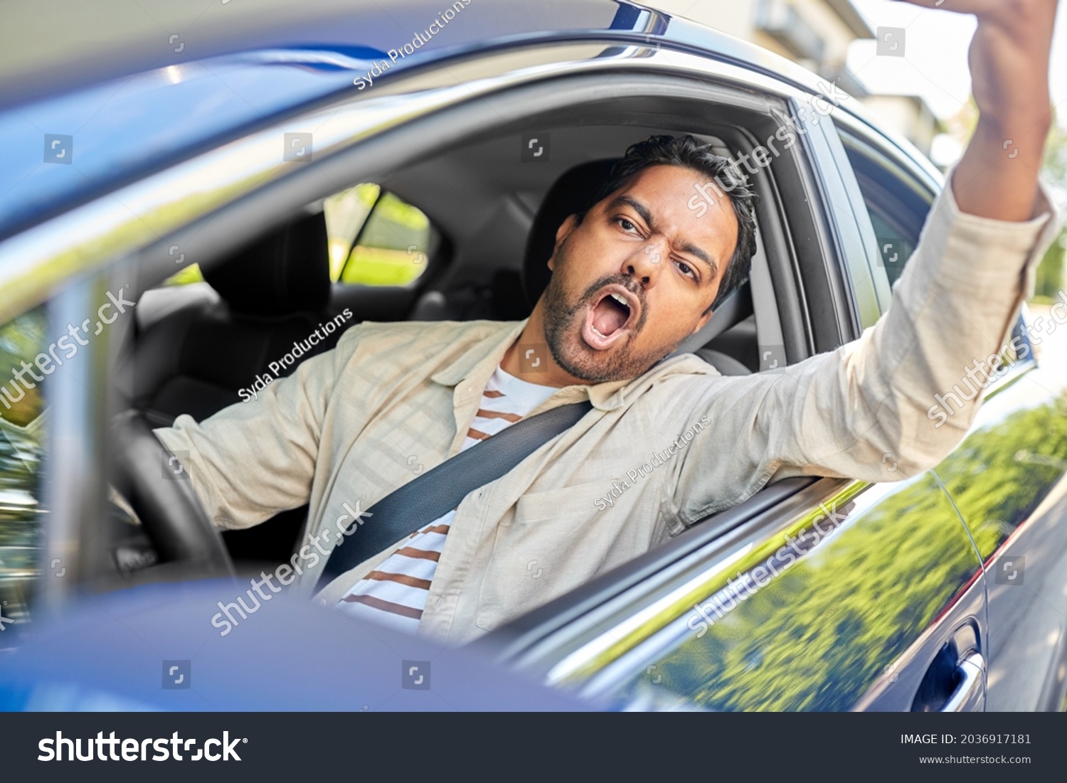 transport, vehicle and people concept - angry indian man or driver driving car and gesturing #2036917181