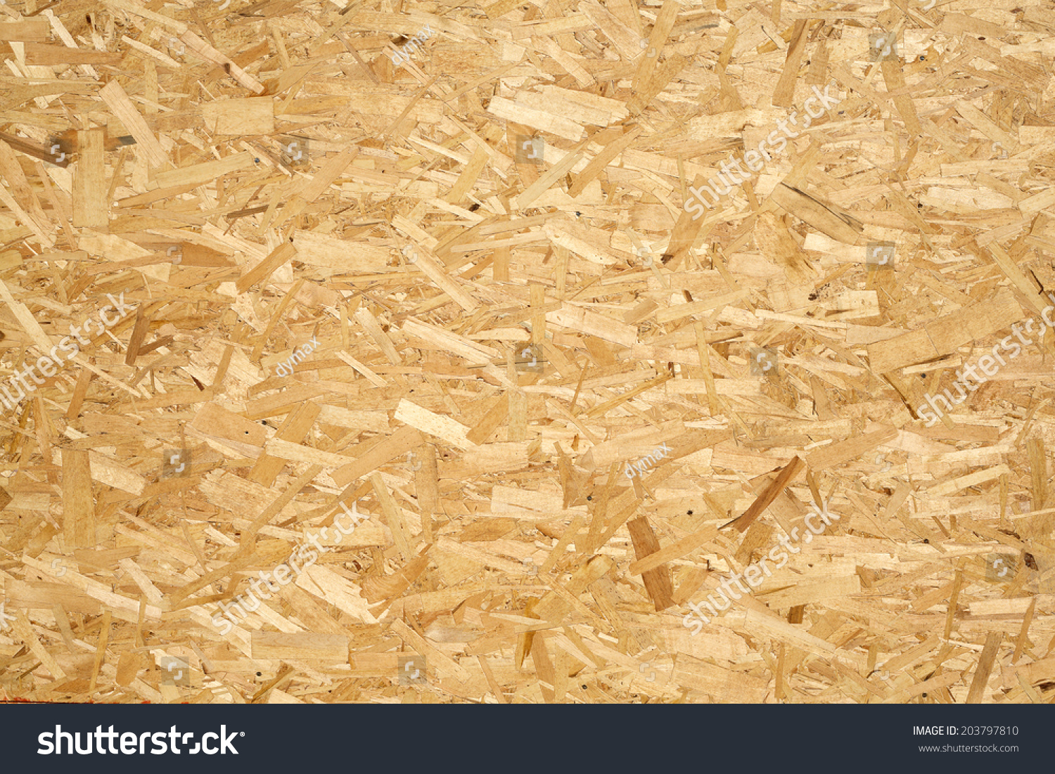Oriented Strand Board. Chipboard building material. OSB wooden panel made of pressed sandy brown wood shavings as background closeup #203797810