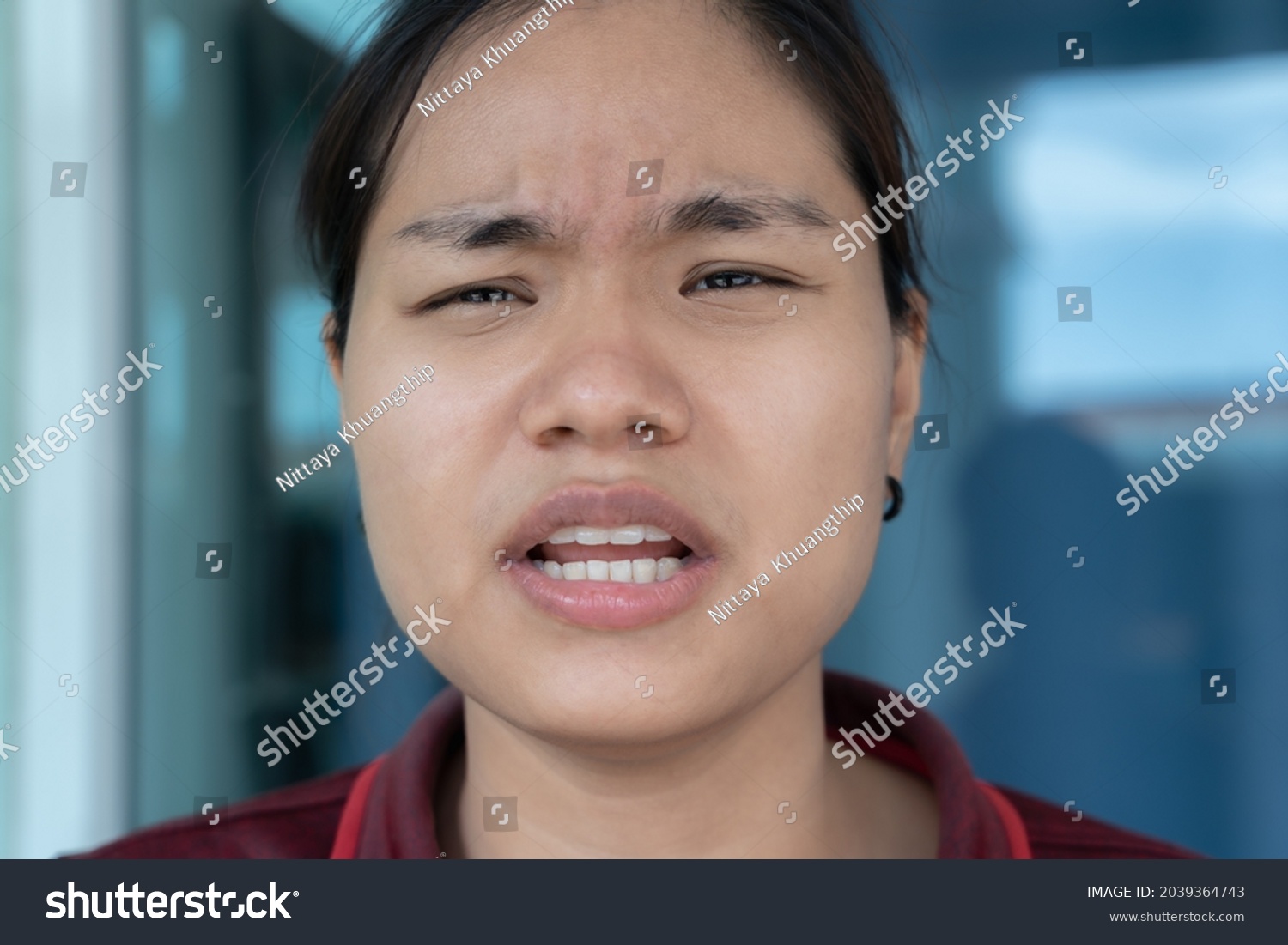 Confused young girl expressing distrust and suspicion, doubt and confusion concept. Woman with disgruntled face, complaining and arguing, talking troubled uneasy, stare camera angry. Human emotion #2039364743