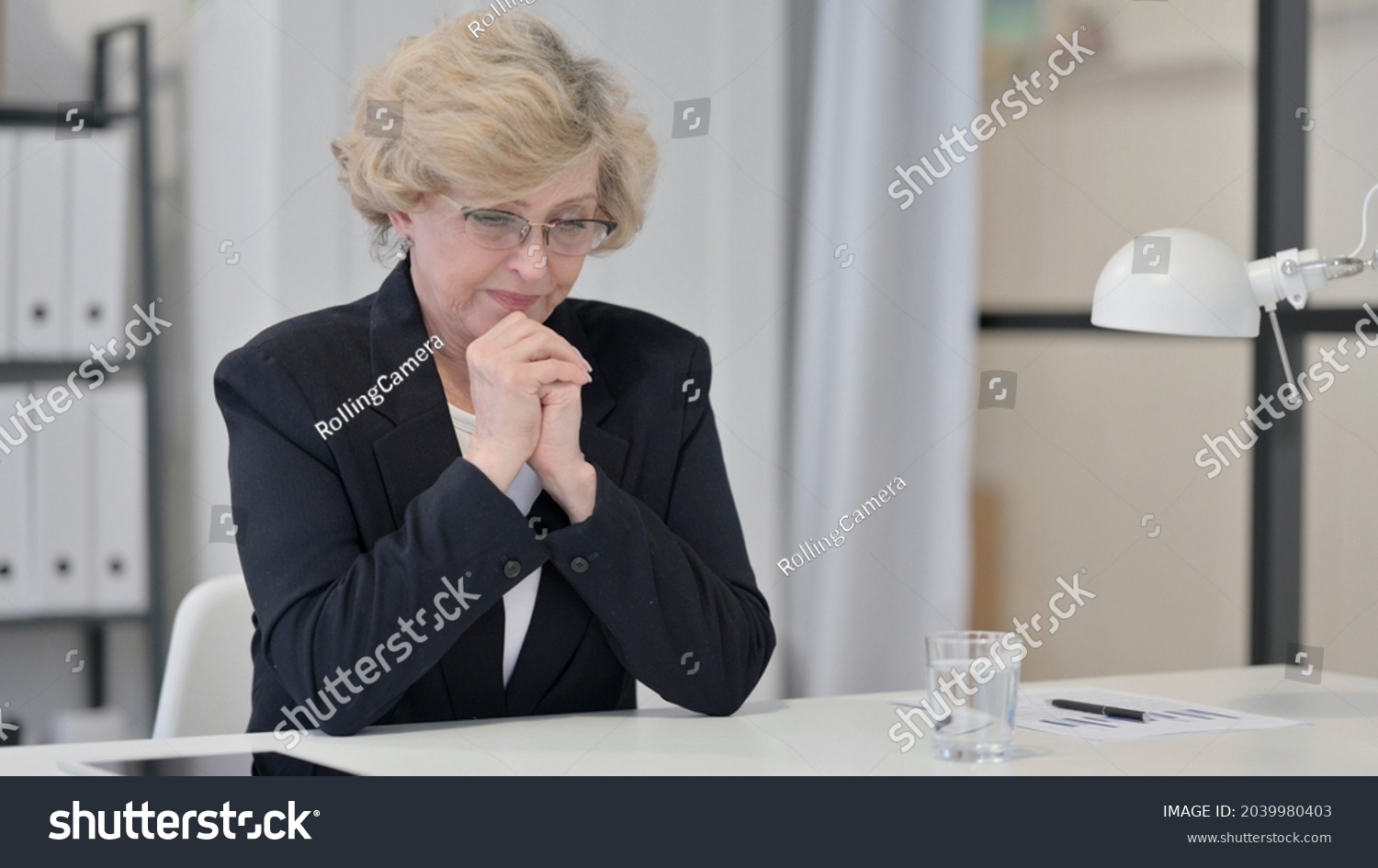 Old Businesswoman Thinking and Feeling Worried  #2039980403