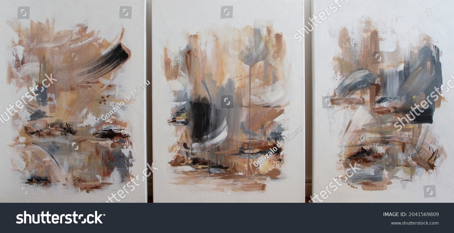 Three contemporary abstract paintings on the art studio. Nonfigurative abstract paintings of the same artistic series with colorful stains and strong brush texture. #2041569809