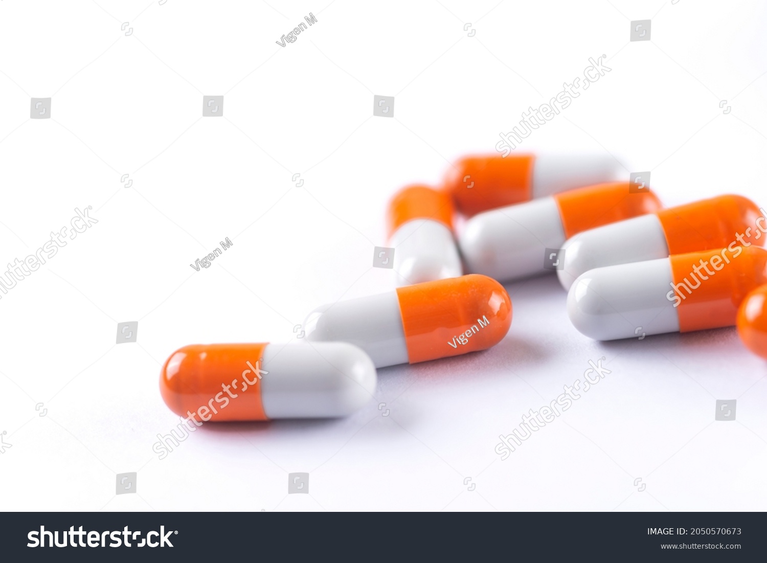 Drug prescription for treatment medication. Pharmaceutical medicament,  Pharmacy theme, Heap of orange white medicament #2050570673