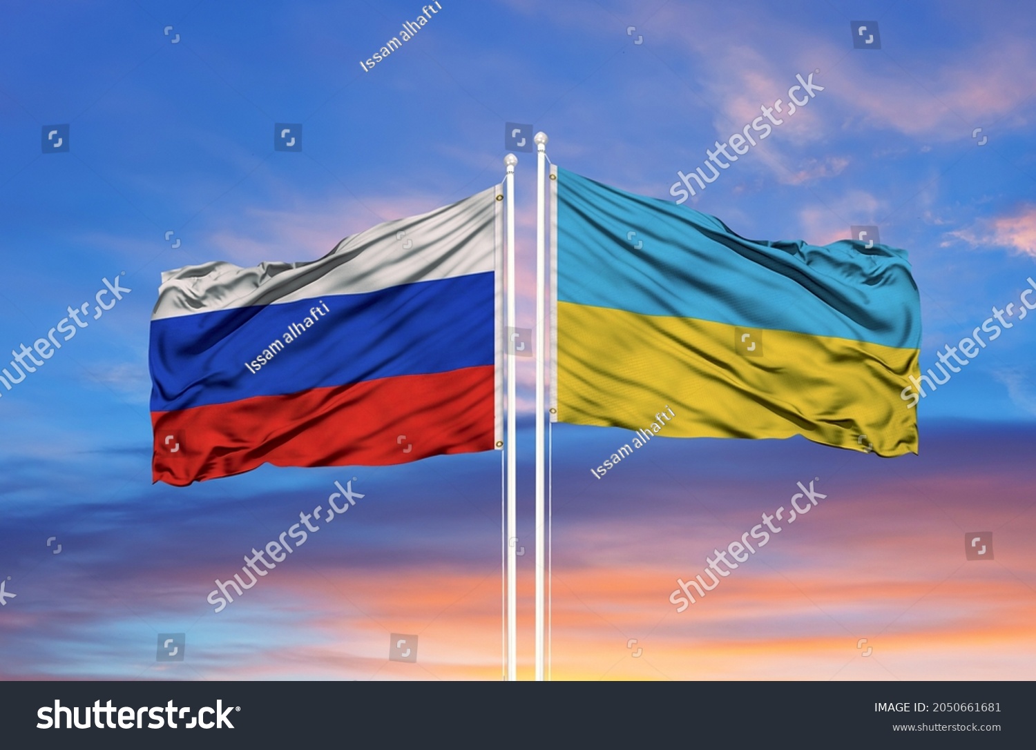 Ukraine and Russia two flags on flagpoles and blue sky #2050661681