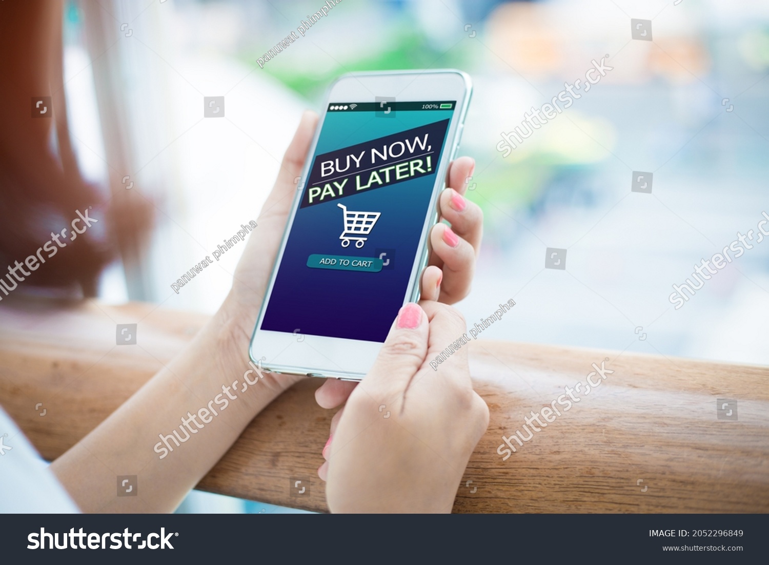 BNPL Buy now pay later online shopping concept.Hands holding mobile phone #2052296849