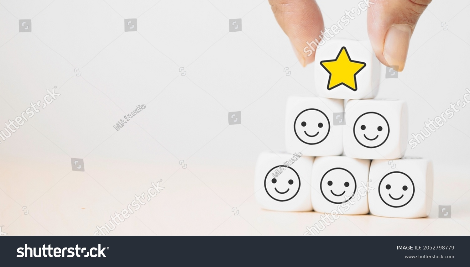 Hand putting dice cube with icon face smiley feedback, best excellent business services rating customer experience, Satisfaction survey.kid evaluation reward, encourage.Mental health, child emotion. #2052798779