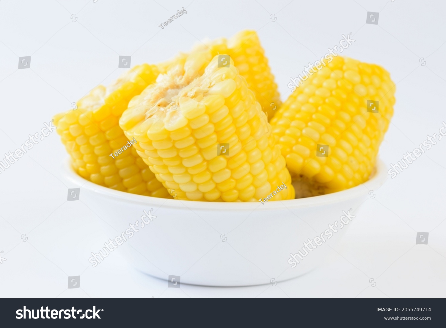 Many pieces of delicious boil corns in white bowl on white background #2055749714