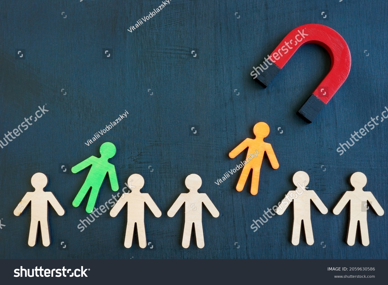 The magnet attracts figures from the crowd. Talent acquisition concept. #2059630586