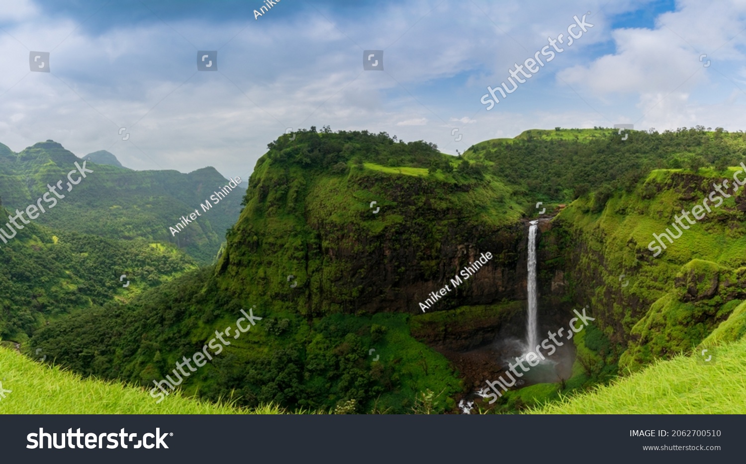 Beautiful waterfall with dramatic sky, somewhere in the Sahyadri ranges of western ghats of Maharashtra #2062700510