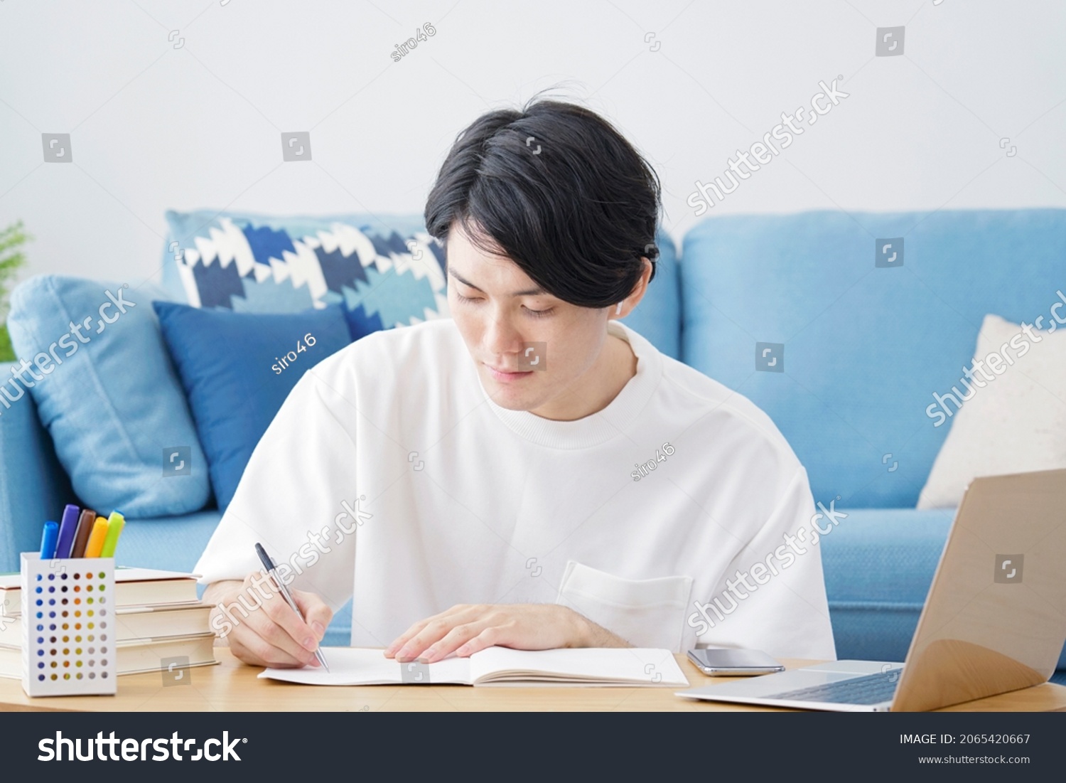 Asian man studying at home #2065420667
