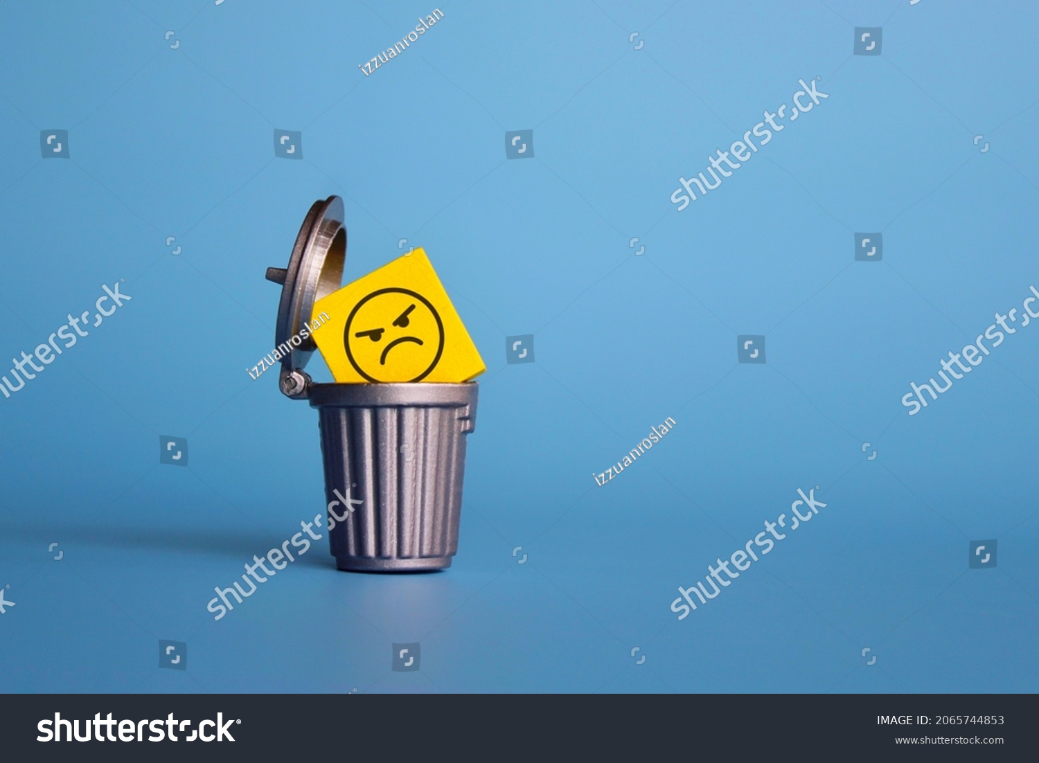 Remove negative thoughts, anger management concept. Wooden cube with angry face icon inside dustbin, trash can. #2065744853