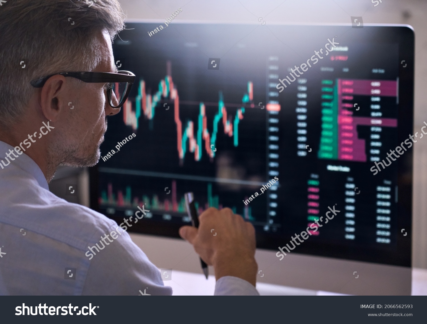Crypto trader investor analyst broker using pc computer analyzing online cryptocurrency exchange stock market indexes charts investing money profit in trading platform stockmarket. Over shoulder view. #2066562593