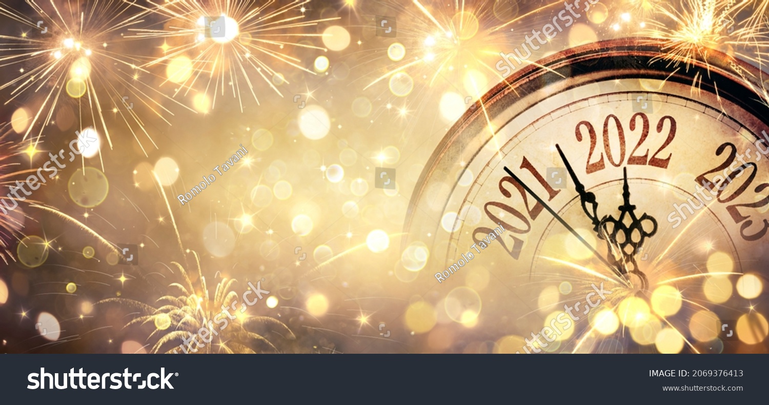 2022 New Year - Clock And Fireworks - Countdown To Midnight  - Golden Abstract Defocused Background #2069376413