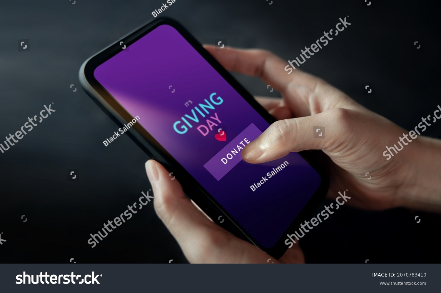 Online Donation, Charity and Volunteering Concept. Closeup of Hand Using a Mobile Phone to making Donate via the Internet #2070783410