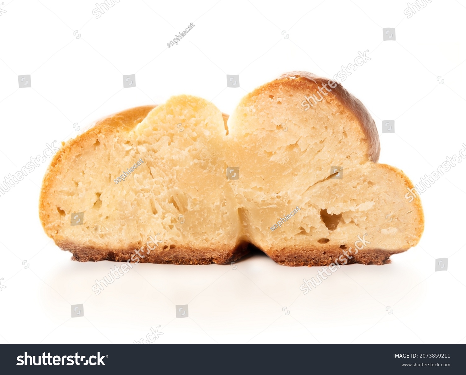 Baked yeast bread slice with undercooked and raw dough. Cross-section of white bread called zopf or challa. Concept for danger of eating raw dough, baking problems or stove broken. Isolated on white. #2073859211