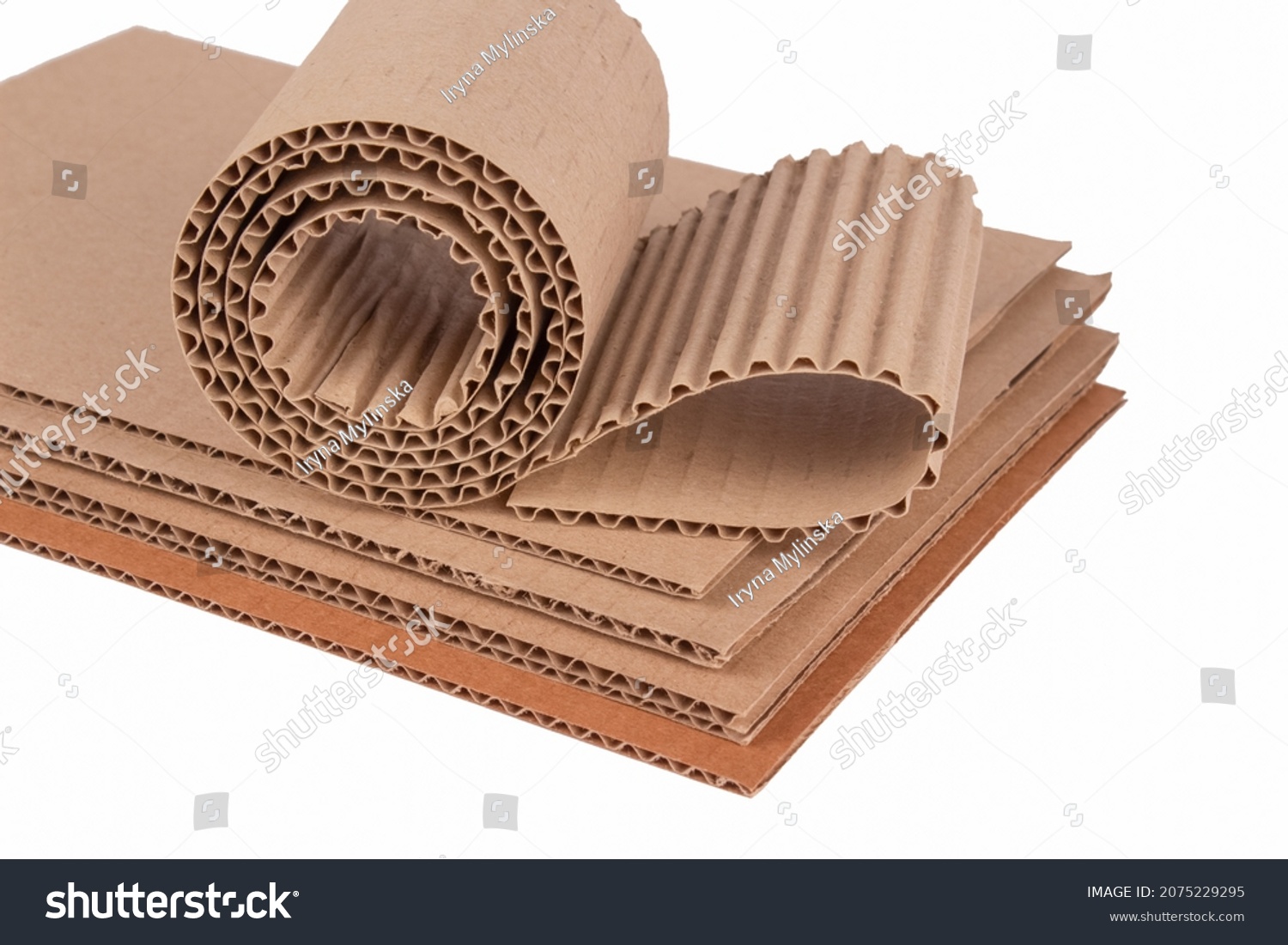 Corrugated cardboard layer pads and flexible singleface corrugated paper in roll isolated on white. Environmentally friendly paper packaging. Packaging for safe transportation #2075229295