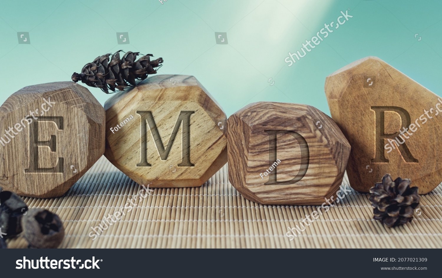 Letters EMDR written on wooden irregular blocks. Eye Movement Desensitization and Reprocessing psychotherapy treatment concept. #2077021309