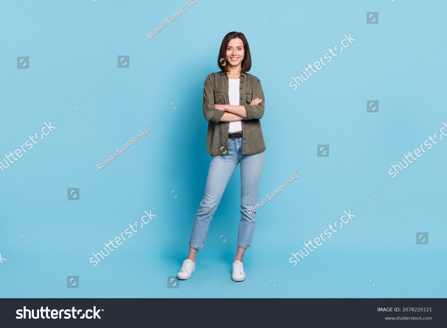 Full body photo of cool satisfied glad lady stand with folded arms wear khaki clothes isolated over sky light color background #2078220121