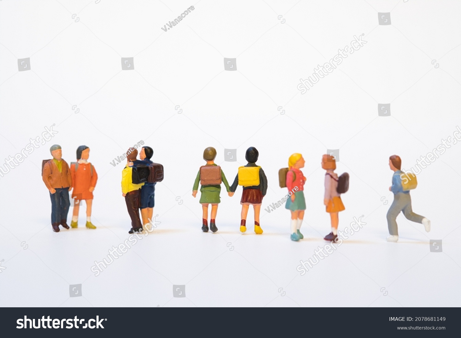 miniature group of school children with school bag on white background #2078681149