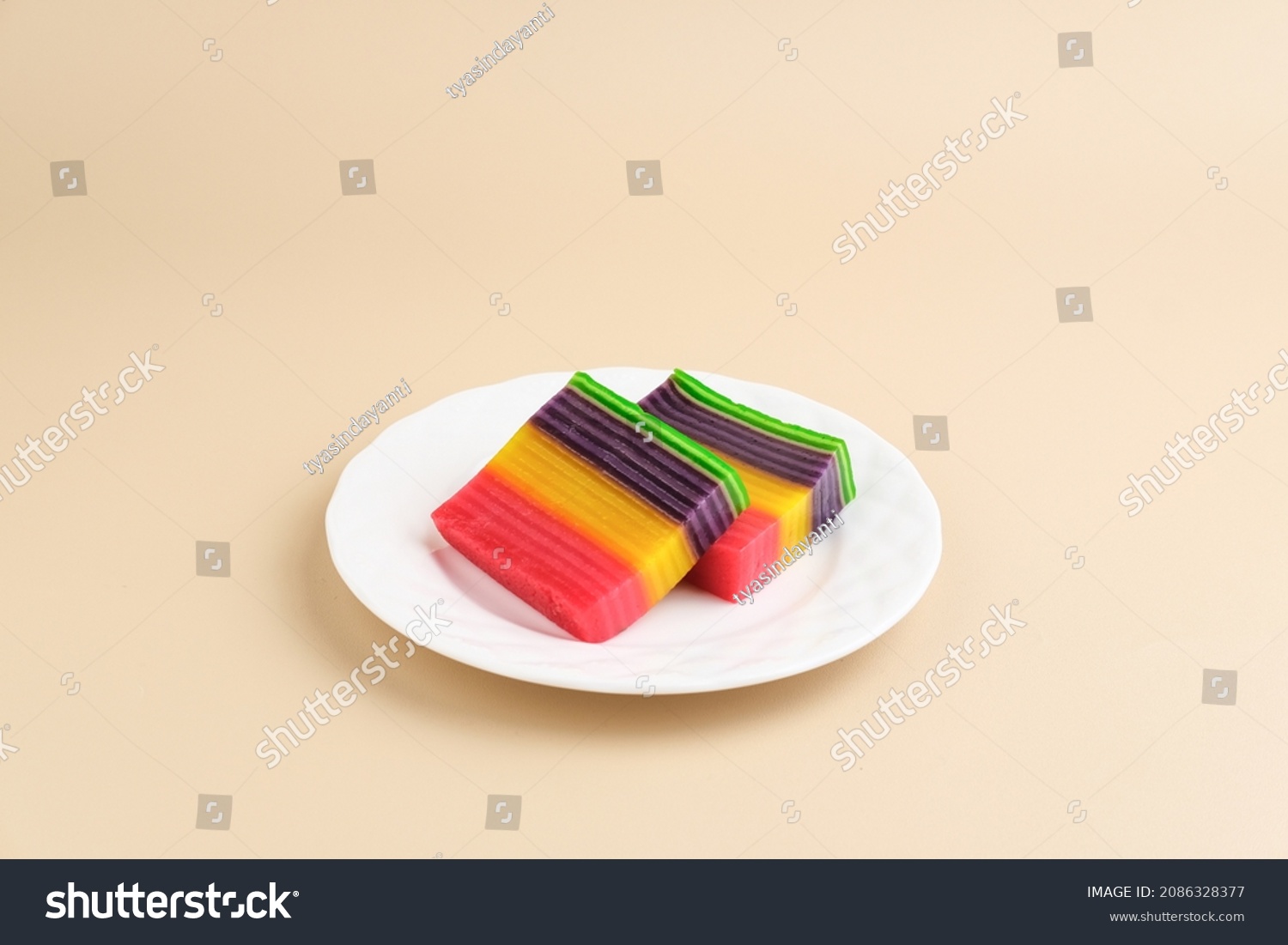 Kue Lapis or Kue Pepe or Rainbow sticky layer cake, Indonesian traditional dessert made from rice flour and coconut milk, steamed layer by layer. Selective focus. #2086328377