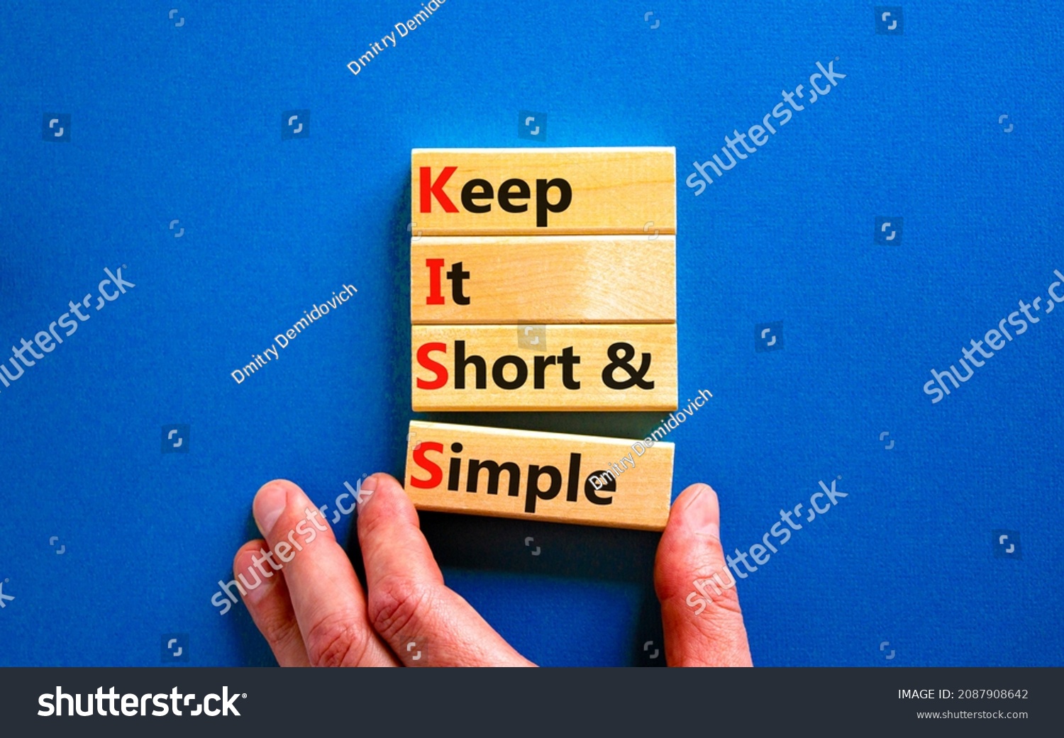 KISS keep it short and simple symbol. Concept words KISS keep it short and simple wooden blocks. Beautiful blue table, blue background. Business KISS keep it short and simple concept. Copy space. #2087908642
