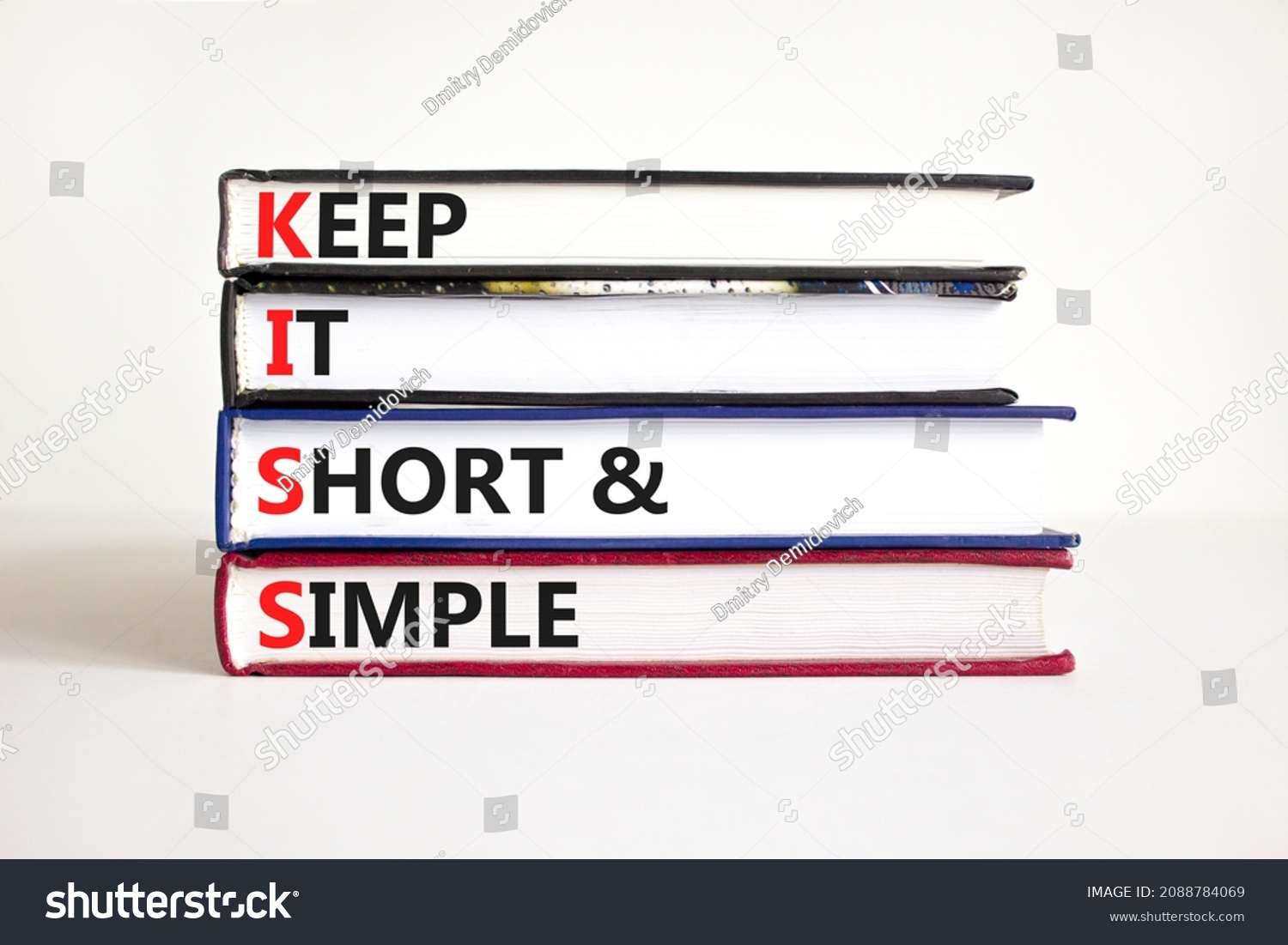 KISS keep it short and simple symbol. Concept words KISS keep it short and simple on books. Beautiful white table, white background. Business KISS keep it short and simple concept. Copy space. #2088784069