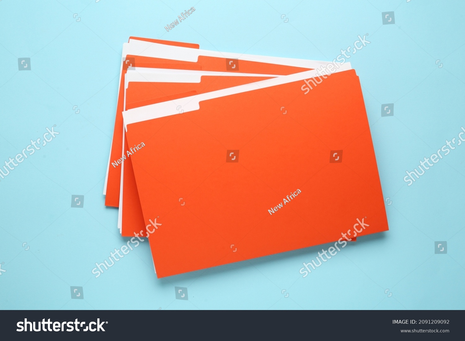 Orange files with documents on light blue background, top view #2091209092