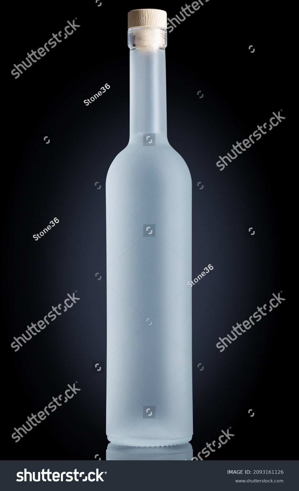 Glass bottle with frost effect on black background. Vodka, gin, or pure water bottle for mock-up. #2093161126
