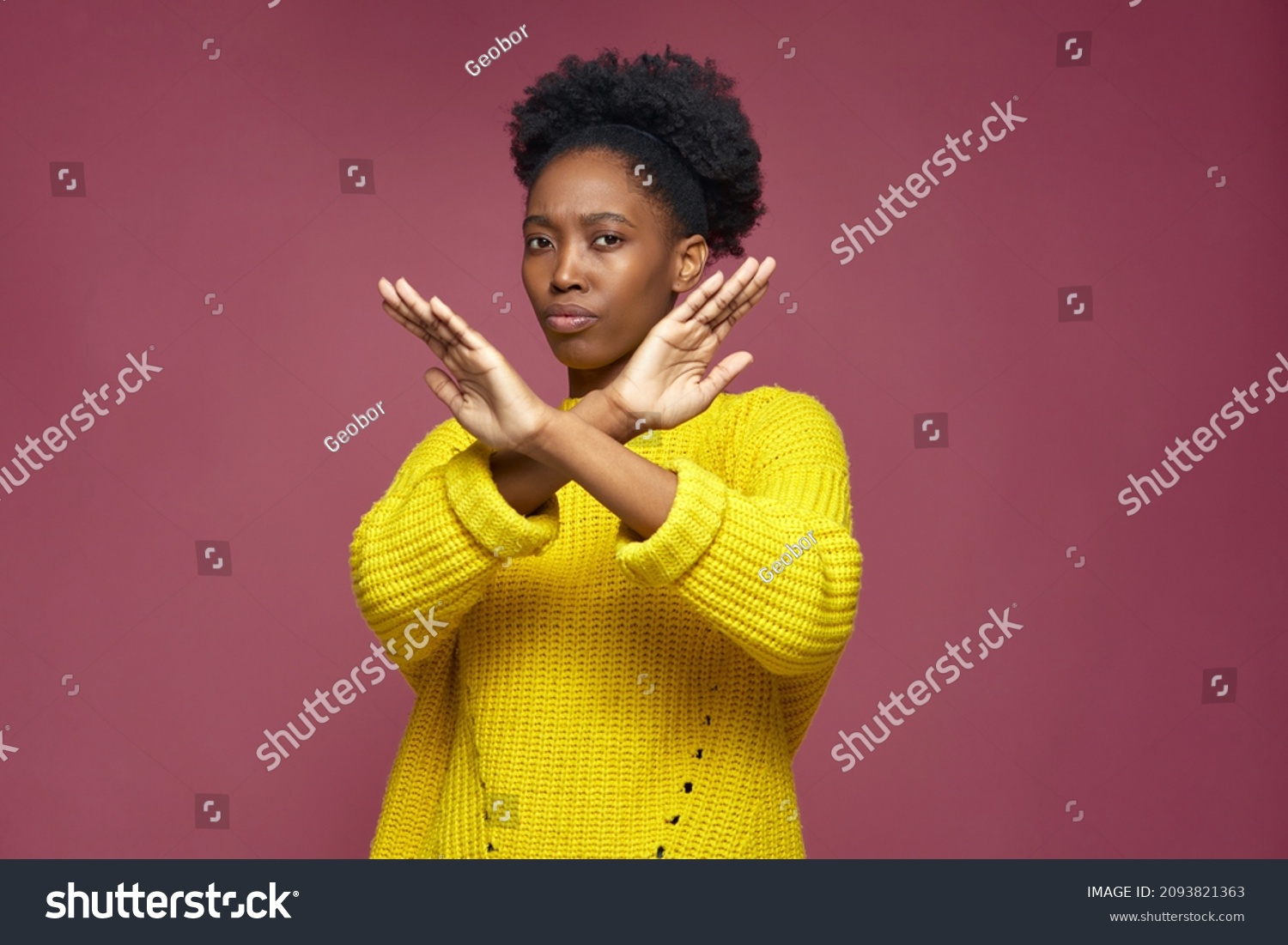 Serious young african american woman show stop finish gesture by crossed hands, protest against racial discrimination #2093821363