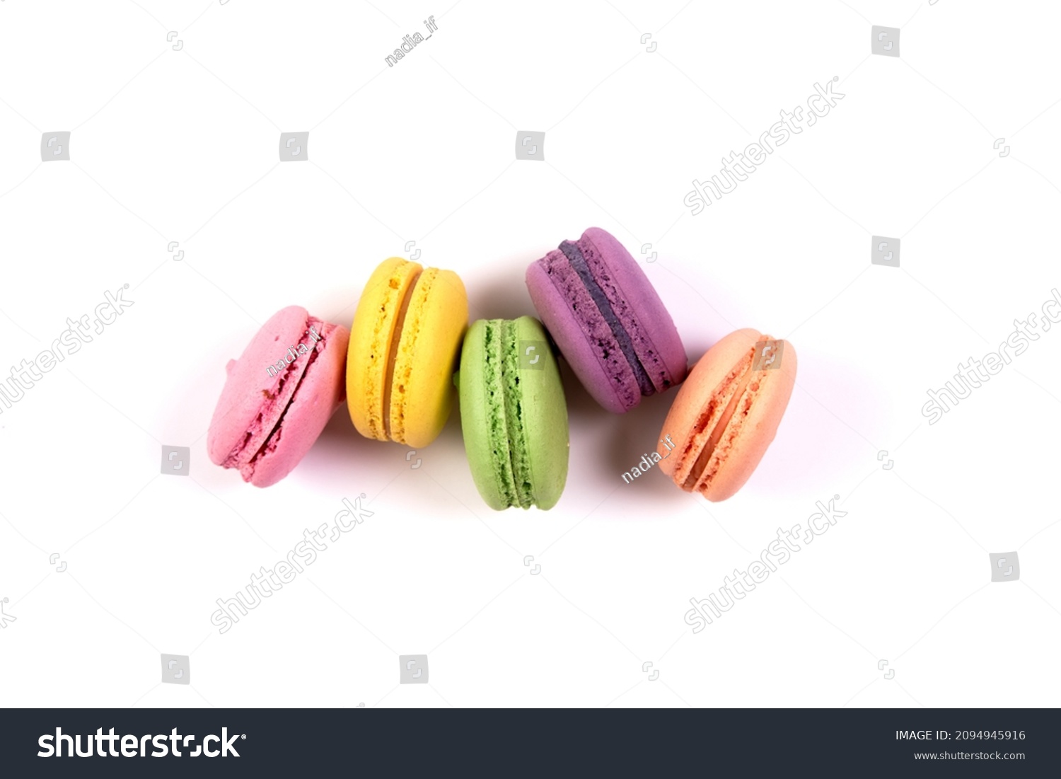 Sweet colorful macarons isolated on white background. Tasty colourful macaroons. High quality photo #2094945916
