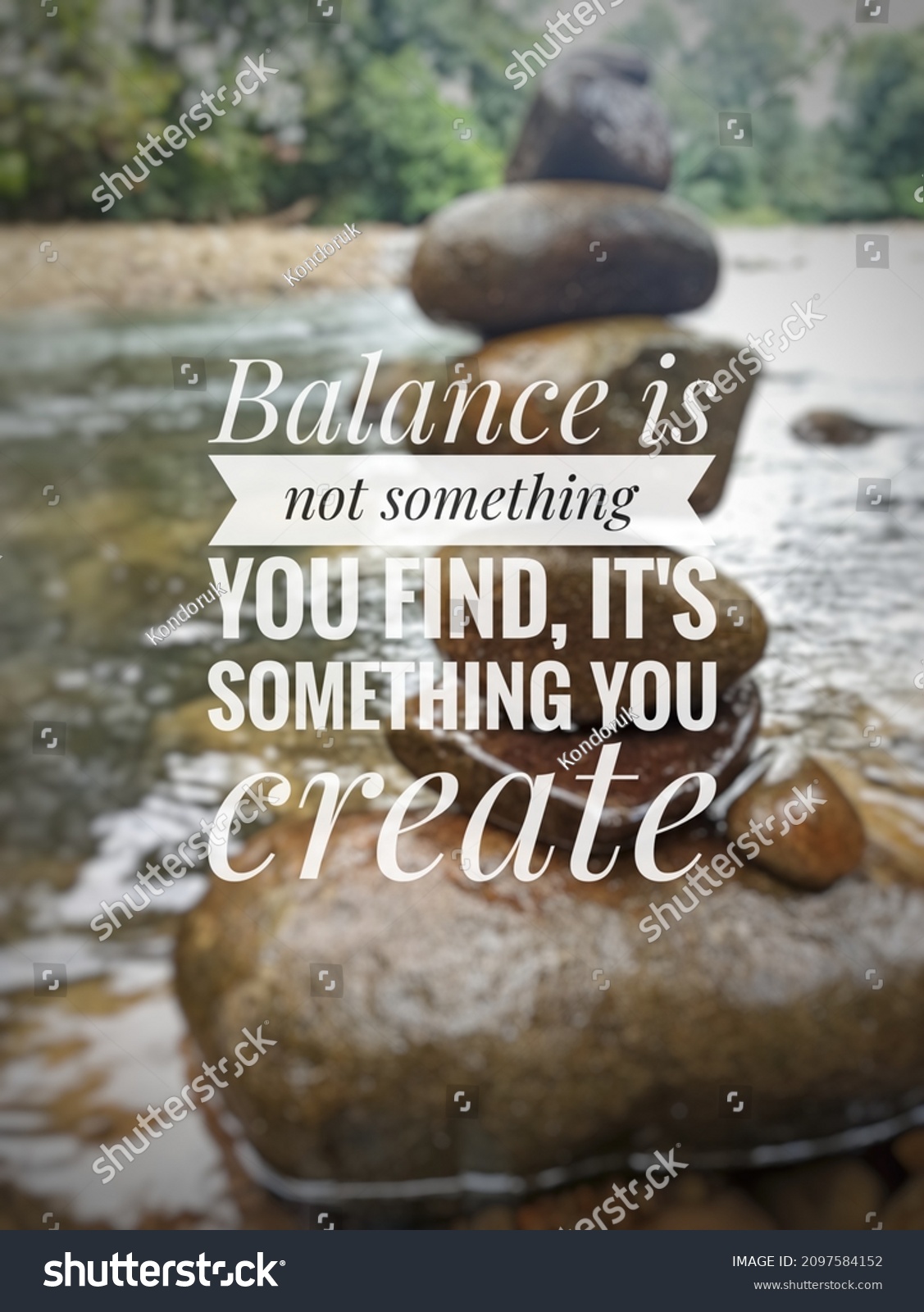 Blurry stacked of Zen stone on nature background with Inspirational quotes - Balance is not something you find, It's something you create #2097584152