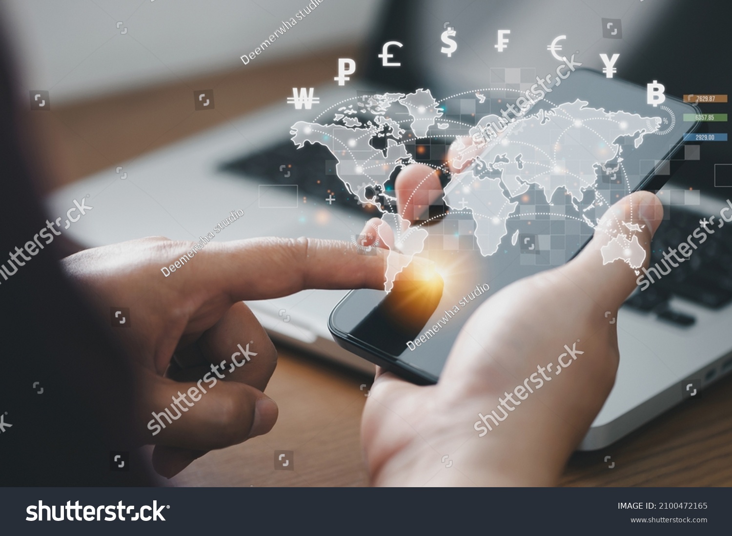 Man using mobile phone and laptop computer to money transfers and currency exchanges between countries of the world. online banking interbank payment concept. #2100472165