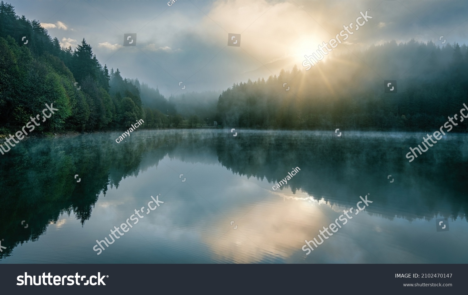 Beautiful scenic view of Savsat Karagol Black lake in Eastern Black Sea region with morning evaporation. Savsat Karagol lake is a large trout lake in the forest in Artvin, Turkey #2102470147