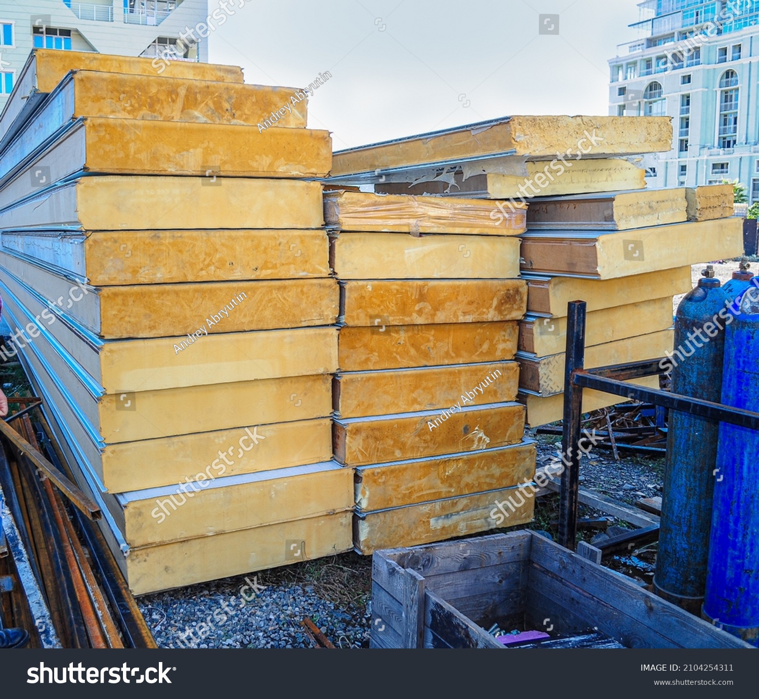 Construction site with stacked PUR sandwich panels. Prefabricated Insulating #2104254311