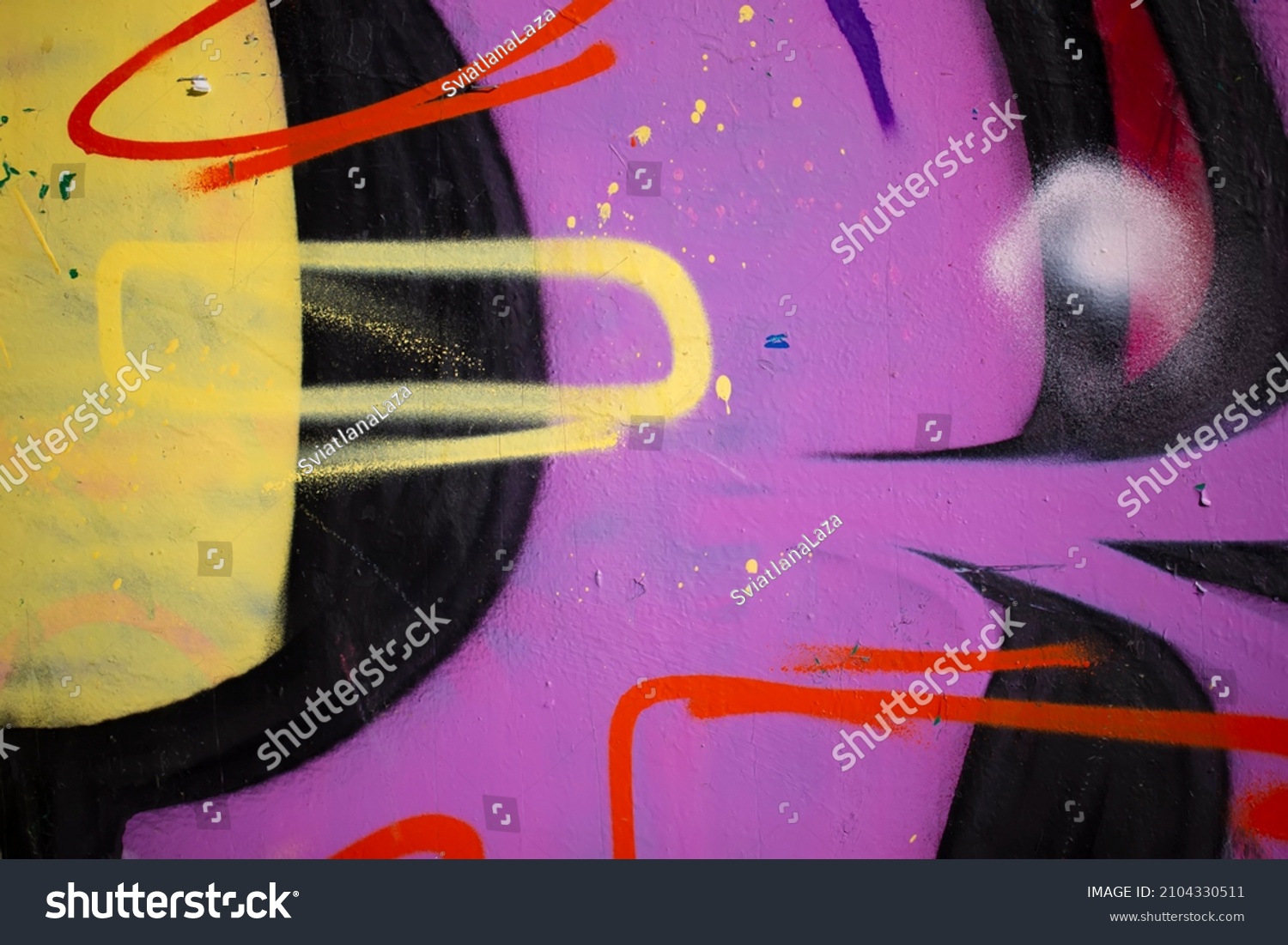 Fragments of a painted wall. The wall is painted with spray paint. Concrete graffiti wall texture. #2104330511