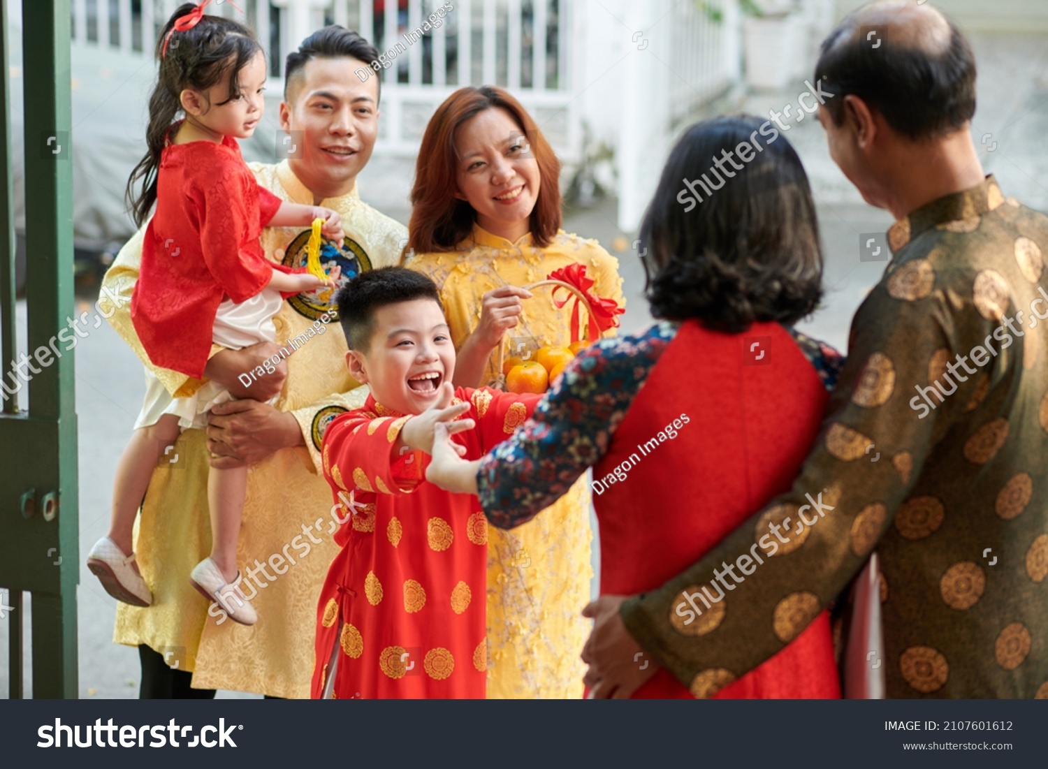 Excited kid happy to visit his grandparents for Chinese New Year family reunion #2107601612
