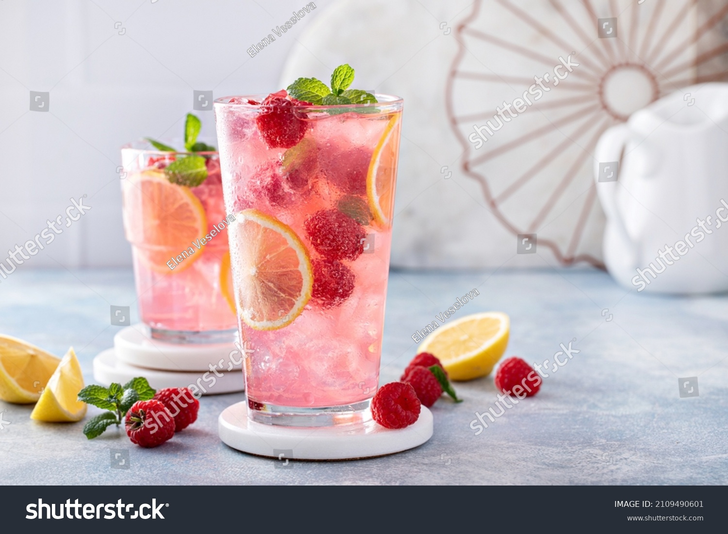 Spring or summer refreshing cold cocktail or mocktail with berries and lemon, raspberry lemonade #2109490601