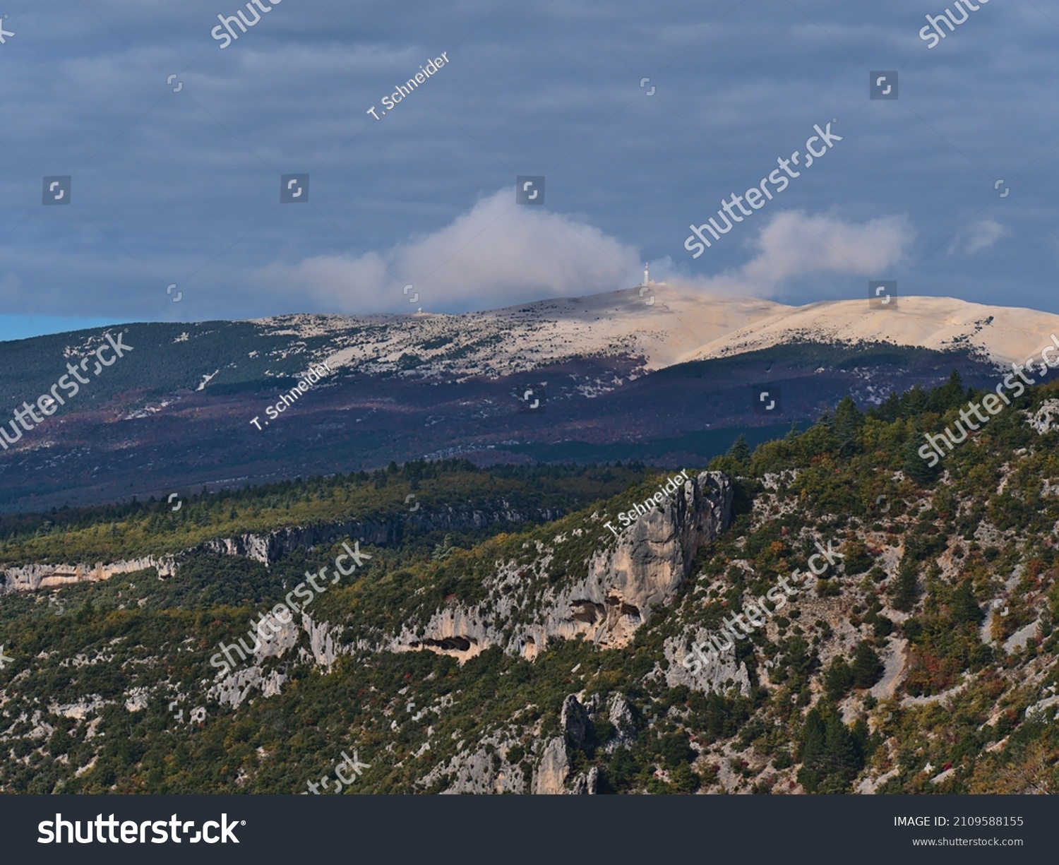 Beautiful view of bare mountain Mont Ventoux above the rocky canyon Gorges de la Nesque in the Vaucluse Mountains in Provence region, France on sunny day in autumn season with cloudy in the sky. #2109588155