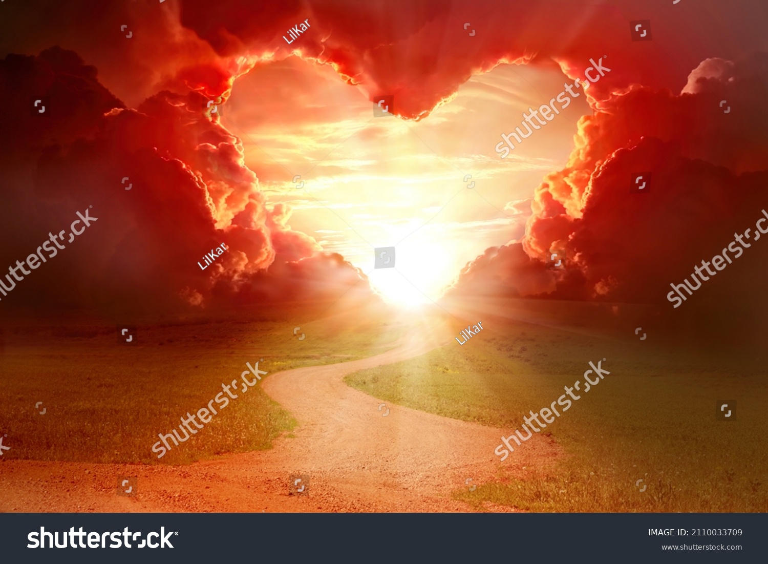  Red heart shaped sky at sunset. Beautiful landscape with road and clouds.Love background with copy space. Road to love  #2110033709