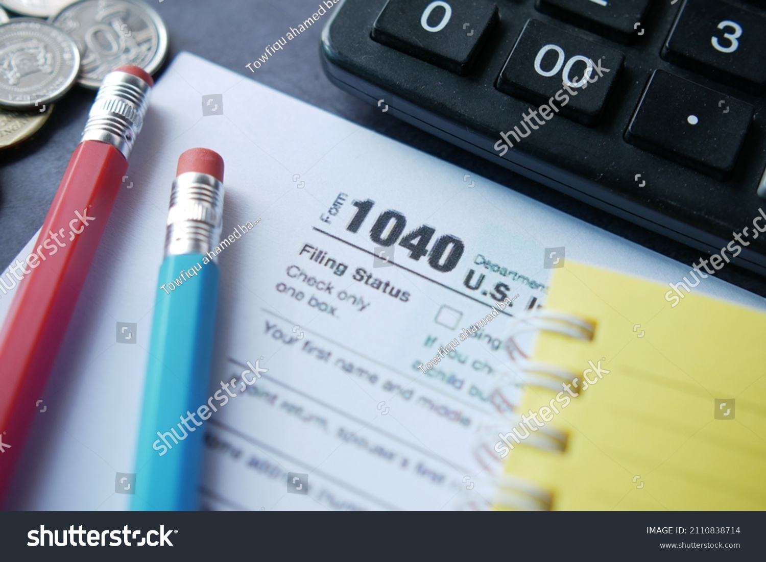 Close up of a Tax return form and pen on table. #2110838714