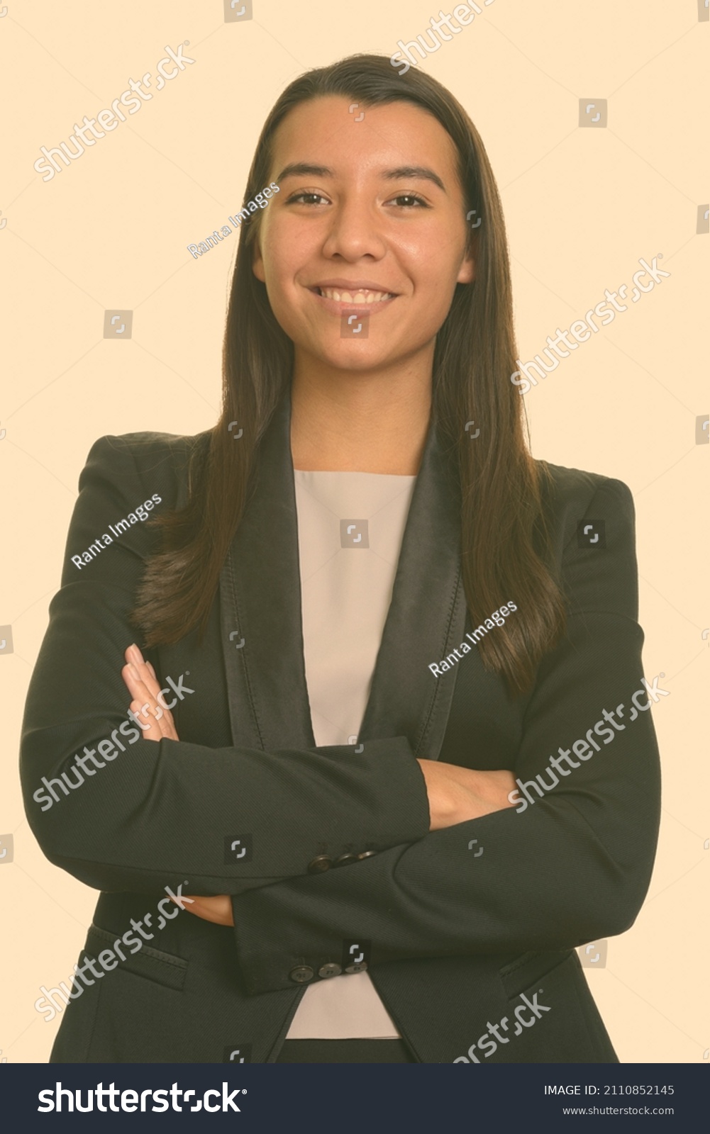Portrait of young beautiful woman shot against studio background #2110852145