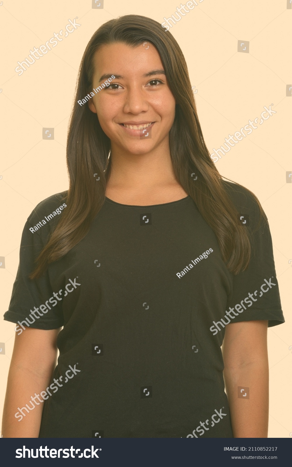 Portrait of young beautiful woman shot against studio background #2110852217