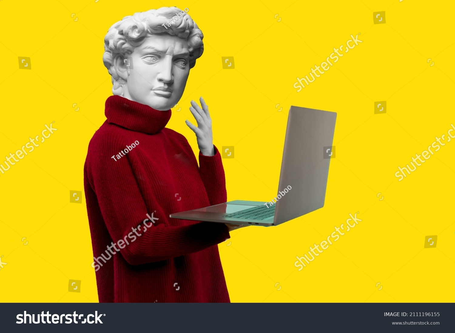 Abstract modern collage. The man with the plaster head of David in a red sweater looks at a laptop screen on a yellow background #2111196155