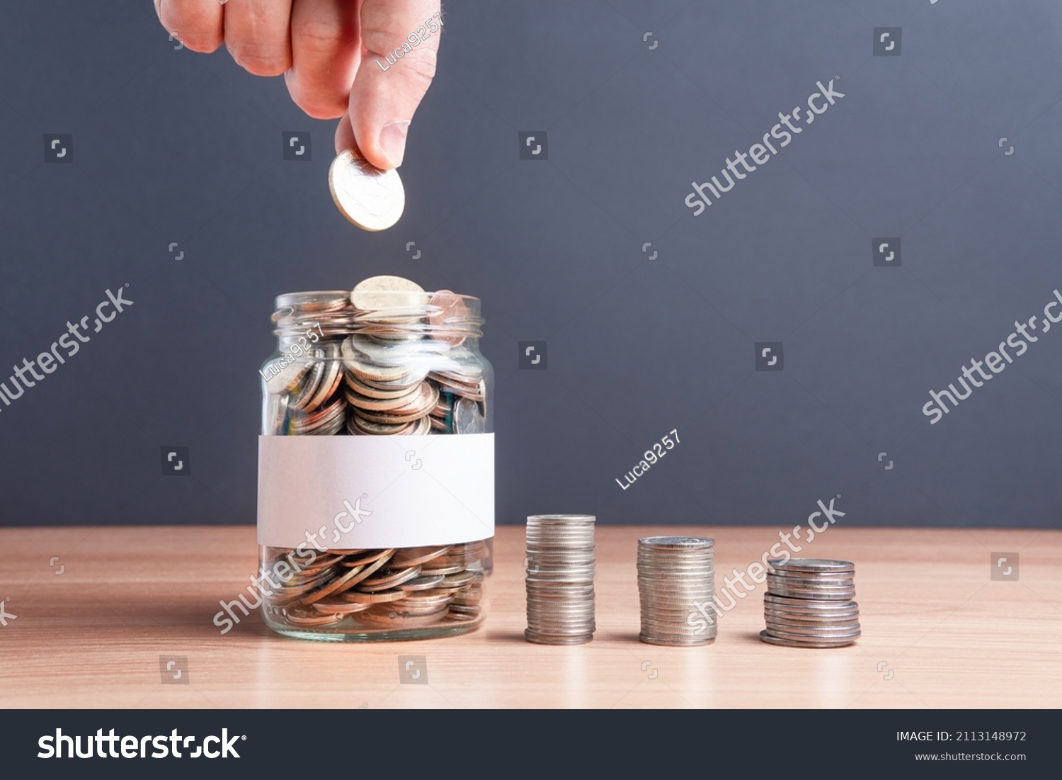 The coins are in a glass jar . Investment concept. Economic growth. Business management. Capital accumulation. Financial literacy. #2113148972