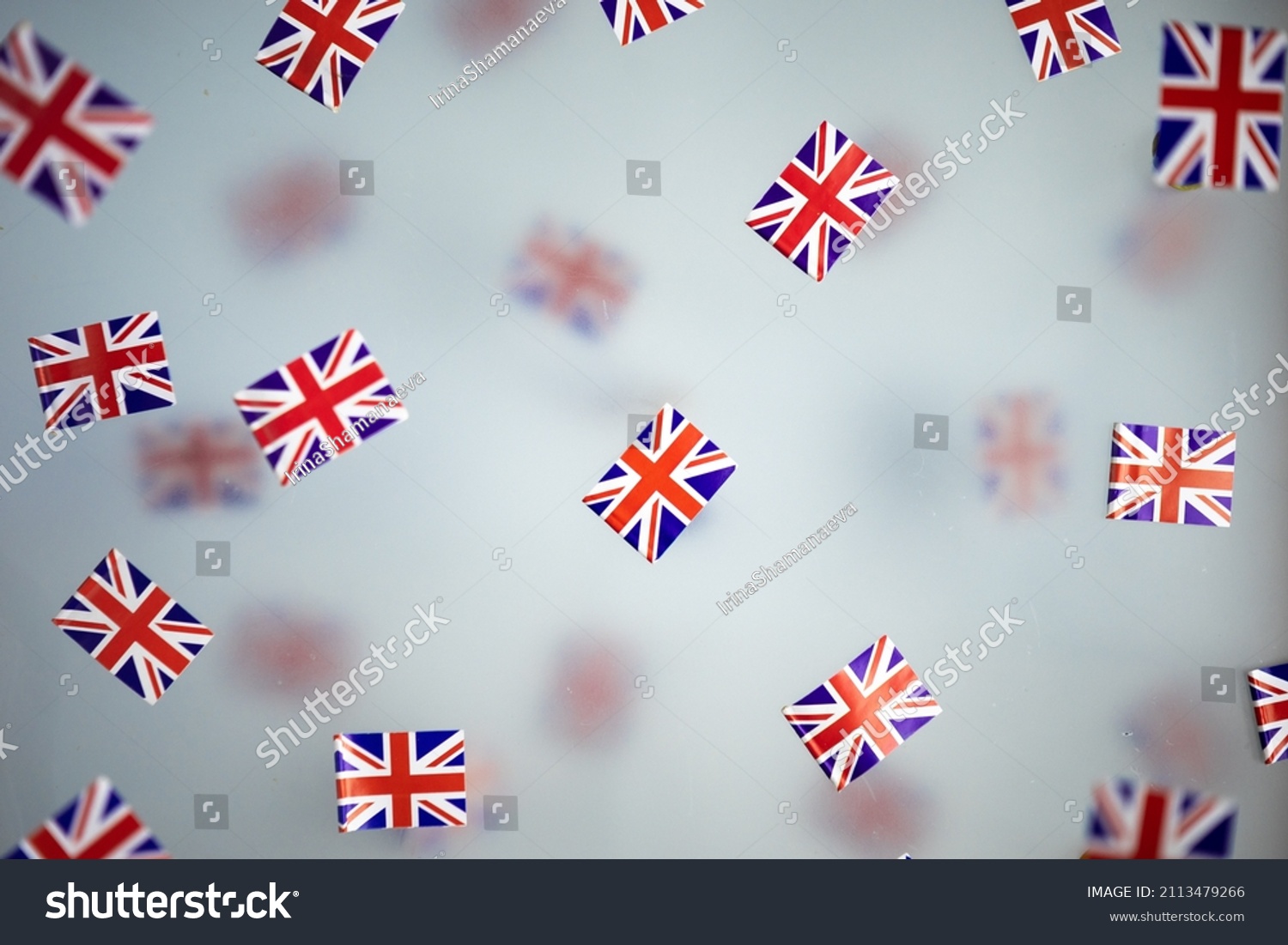 Great Britain, national holiday country. Mini flags on a transparent foggy background. concept patriotism, pride and freedom. Platinum Jubilee of Queen Elizabeth II. High quality photo #2113479266